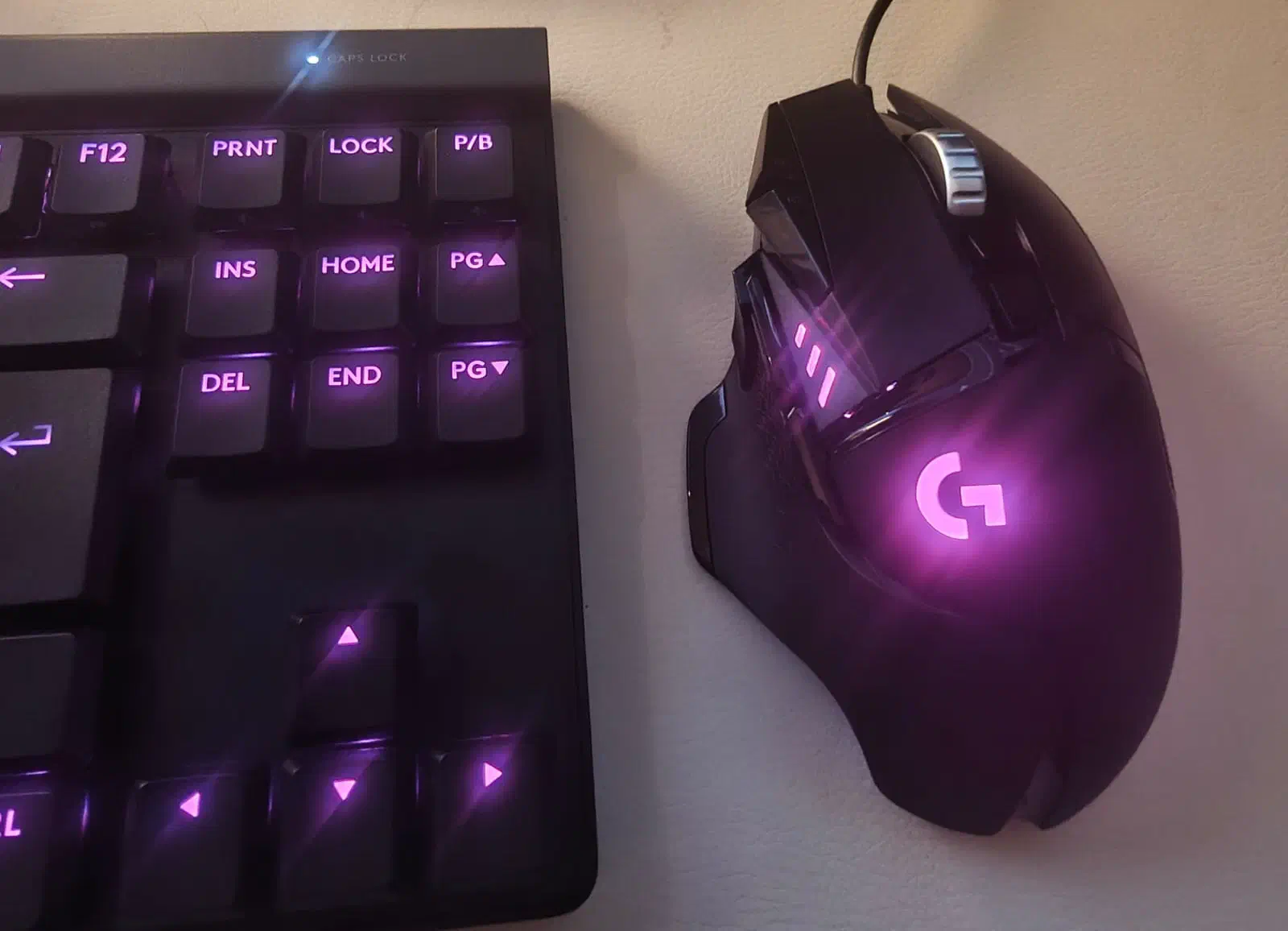 Logitech G515 TKL and G502 HERO with purple lighting